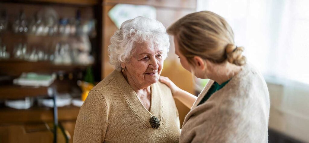 Care assistant supporting elderly resident at Roselands Care Home – exceptional elderly care in Rye
