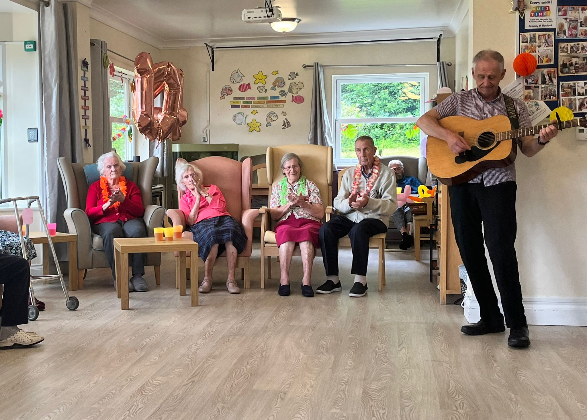 Residents enjoying a live music activity at Roselands Care Home in Rye – social engagement for elderly wellbeing